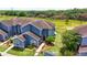 Aerial view of a blue house and surrounding landscape at 435 Caribbean Dr, Davenport, FL 33897
