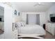 Bright bedroom with a queen-size bed and ample closet space at 435 Caribbean Dr, Davenport, FL 33897
