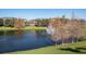 Scenic lake view with a fountain and residential building in background at 401 New Providence Promenade # 12401, Davenport, FL 33897