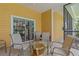 Screened patio with glass-top table and chairs at 401 New Providence Promenade # 12401, Davenport, FL 33897