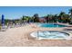 Resort-style pool and hot tub with lounge chairs at 401 New Providence Promenade # 12401, Davenport, FL 33897