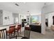 Open living room features a fireplace, sliding glass doors, and a partial kitchen view at 8810 Dunes Ct # 203, Kissimmee, FL 34747