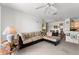 Comfortable living room with a sectional sofa and views into dining and kitchen areas at 8810 Dunes Ct # 203, Kissimmee, FL 34747