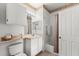 Clean bathroom with tub shower, vanity, and toilet at 8810 Dunes Ct # 203, Kissimmee, FL 34747
