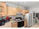 Efficient kitchen offering ample cabinetry, a full suite of appliances, and a convenient layout at 8810 Dunes Ct # 203, Kissimmee, FL 34747