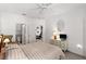 Spacious bedroom with ensuite bathroom and dresser at 8810 Dunes Ct # 203, Kissimmee, FL 34747