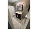 Clean bathroom with dark vanity and marble flooring at 4301 Lizshire Ln # C-109, Orlando, FL 32822