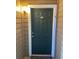 Condo building entryway with green door and number 109 at 4301 Lizshire Ln # C-109, Orlando, FL 32822