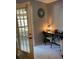 Home office with desk, chair, and view to a patio at 4301 Lizshire Ln # C-109, Orlando, FL 32822