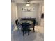 Cozy dining area with round table and four chairs at 4301 Lizshire Ln # C-109, Orlando, FL 32822