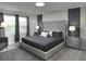 Spacious main bedroom with large bed and en-suite bathroom at 1505 Carey Palm Cir, Kissimmee, FL 34747