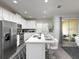 Modern kitchen with stainless steel appliances and breakfast bar at 1505 Carey Palm Cir, Kissimmee, FL 34747