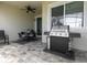 Covered patio with grill and dining area at 1505 Carey Palm Cir, Kissimmee, FL 34747