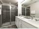 Modern bathroom with double vanity and shower at 1505 Carey Palm Cir, Kissimmee, FL 34747