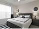 Well-lit bedroom with a king-size bed and nightstands at 1505 Carey Palm Cir, Kissimmee, FL 34747