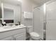 Clean bathroom with a shower and white vanity at 1505 Carey Palm Cir, Kissimmee, FL 34747