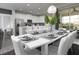 Bright dining room with large table and modern lighting at 1505 Carey Palm Cir, Kissimmee, FL 34747
