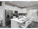 Modern kitchen featuring stainless steel appliances and a large island at 1505 Carey Palm Cir, Kissimmee, FL 34747