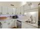 Modern kitchen featuring white cabinets and a marble countertop at 200 Maitland Ave # 2, Altamonte Springs, FL 32701