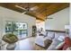 Bright living room with wood floors, sectional sofa, and access to balcony at 200 Maitland Ave # 2, Altamonte Springs, FL 32701