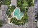 Community pool with unique shape and surrounding landscaping at 200 Maitland Ave # 2, Altamonte Springs, FL 32701