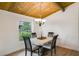 Charming dining area with four chairs and a wood ceiling at 200 Maitland Ave # 2, Altamonte Springs, FL 32701