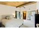Spacious main bedroom with a comfortable bed and access to a balcony at 200 Maitland Ave # 2, Altamonte Springs, FL 32701