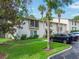 Two-story condo building with lush landscaping and ample parking at 200 Maitland Ave # 2, Altamonte Springs, FL 32701