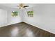 Bright bedroom with wood-look floors and ceiling fan at 2867 Dudley Dr, Bartow, FL 33830