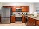 Modern kitchen with stainless steel appliances and granite countertops at 8763 Worldquest Blvd # 5406, Orlando, FL 32821
