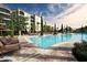 Resort-style pool with lounge chairs at 8763 Worldquest Blvd # 5406, Orlando, FL 32821