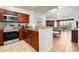 Open kitchen with stainless steel appliances and wood cabinets at 8763 Worldquest Blvd # 5406, Orlando, FL 32821