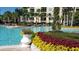 Resort-style pool with lush landscaping at 8763 Worldquest Blvd # 5406, Orlando, FL 32821