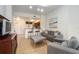 Open concept living room and kitchen with gray sofas at 8763 Worldquest Blvd # 5406, Orlando, FL 32821