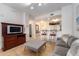 Living room with gray sofas and a view of the kitchen at 8763 Worldquest Blvd # 5406, Orlando, FL 32821