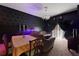 Dark, gothic-themed dining room with access to kitchen and hallway at 315 Lucaya Loop # 315, Davenport, FL 33897