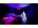Dining area with a table set for a meal, dark walls, and a chandelier at 315 Lucaya Loop # 315, Davenport, FL 33897