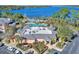 An aerial view of a resort with a pool, restaurant, and lake at 315 Lucaya Loop # 315, Davenport, FL 33897