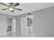Bedroom with ceiling fan, closet, and laundry access at 540 Orange Dr # 13, Altamonte Springs, FL 32701