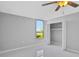 Bedroom with ceiling fan, closet, and lake view at 540 Orange Dr # 13, Altamonte Springs, FL 32701