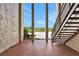 A patio with stairs leading down to a lake view at 540 Orange Dr # 13, Altamonte Springs, FL 32701