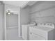 Laundry room with washer, dryer, and shelving at 540 Orange Dr # 13, Altamonte Springs, FL 32701