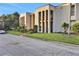 Two-story building exterior with landscaping, showcasing the property's curb appeal at 540 Orange Dr # 13, Altamonte Springs, FL 32701