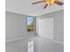 Bedroom with ceiling fan, tiled floors and a window with lake view at 540 Orange Dr # 13, Altamonte Springs, FL 32701