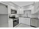 Modern kitchen with stainless steel appliances and white cabinets at 540 Orange Dr # 13, Altamonte Springs, FL 32701