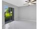 Bright bedroom with sliding glass door leading to patio at 540 Orange Dr # 13, Altamonte Springs, FL 32701