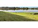 Lakefront property with grassy area and serene view at 540 Orange Dr # 13, Altamonte Springs, FL 32701