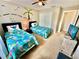 bedroom with twin beds and nautical-themed decor at 4805 Clock Tower Dr, Kissimmee, FL 34746