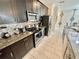 Modern kitchen with stainless steel appliances at 4805 Clock Tower Dr, Kissimmee, FL 34746
