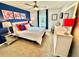 Bedroom with queen bed and blue and pink decor at 4805 Clock Tower Dr, Kissimmee, FL 34746